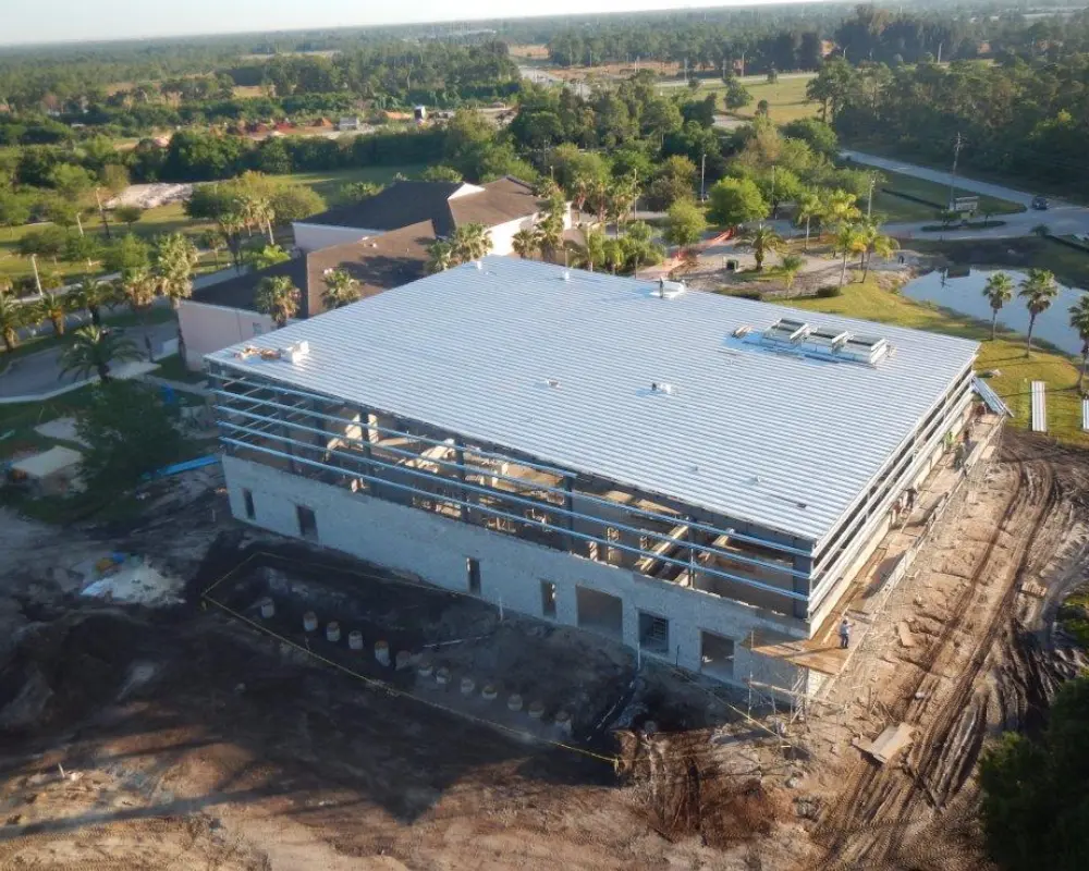 A large building with a white roof Commercial contracting