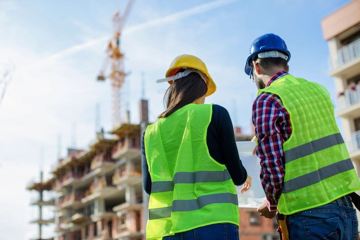 Two people in yellow vests architectural commercial contracting florida